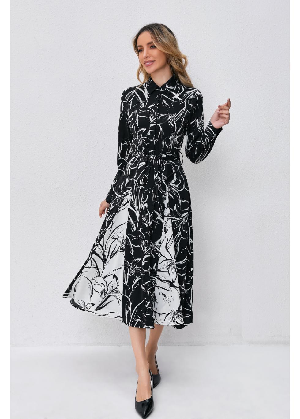 MissFinchNYC monochrome bloom midi dress featuring a floral pattern and elegant silhouette on a hanger.