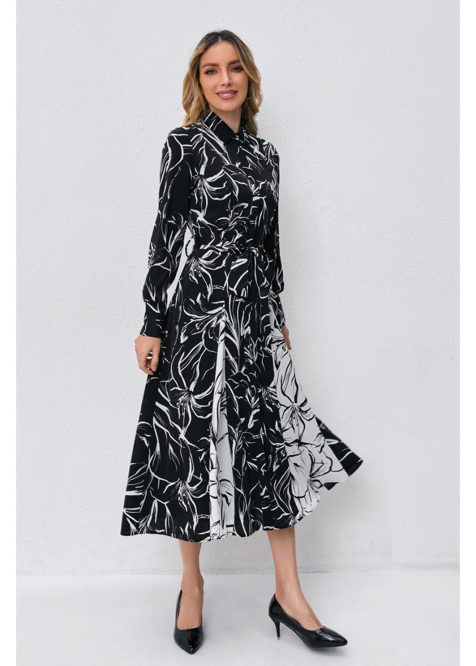 MissFinchNYC monochrome bloom midi dress showing a floral print, sleeveless design, and flowy silhouette on a model.