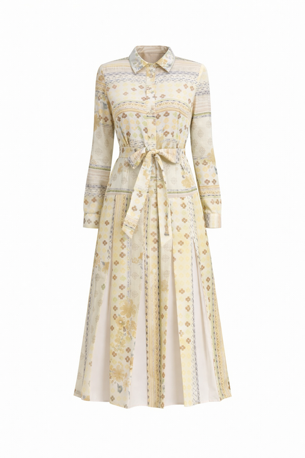 Golden Meadow pleated midi dress from MissFinchNYC, featuring flowing fabric and elegant design, displayed on a hanger.