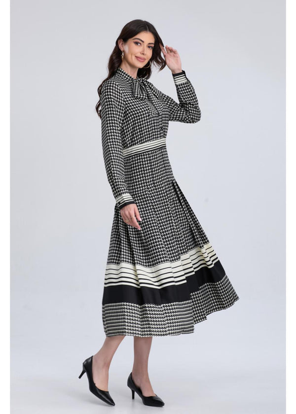 Black and white houndstooth midi dress by MissFinchNYC, featuring a fitted waist and classic A-line silhouette.