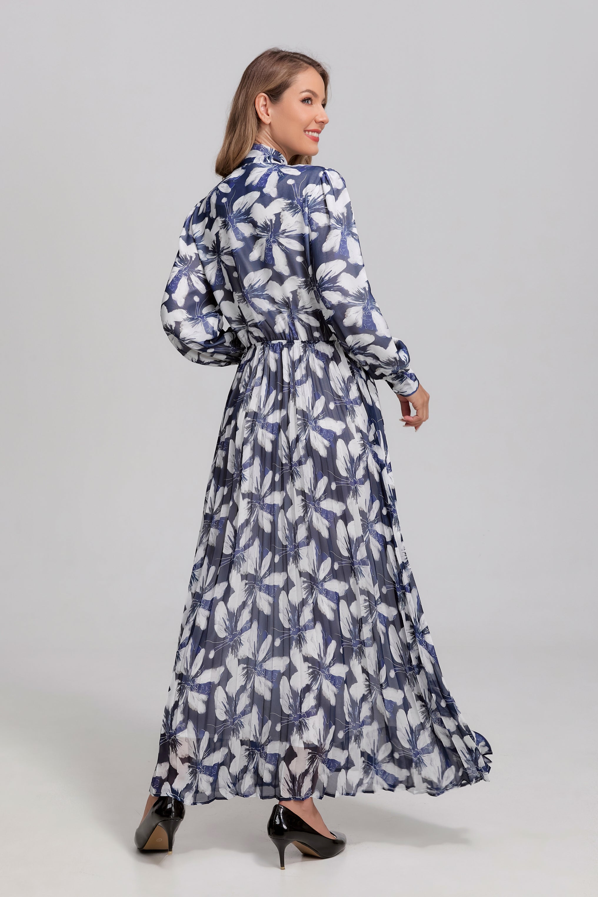 Navy and white feather tie-neck midi dress by MissFinchNYC, featuring a flowing silhouette and elegant design.