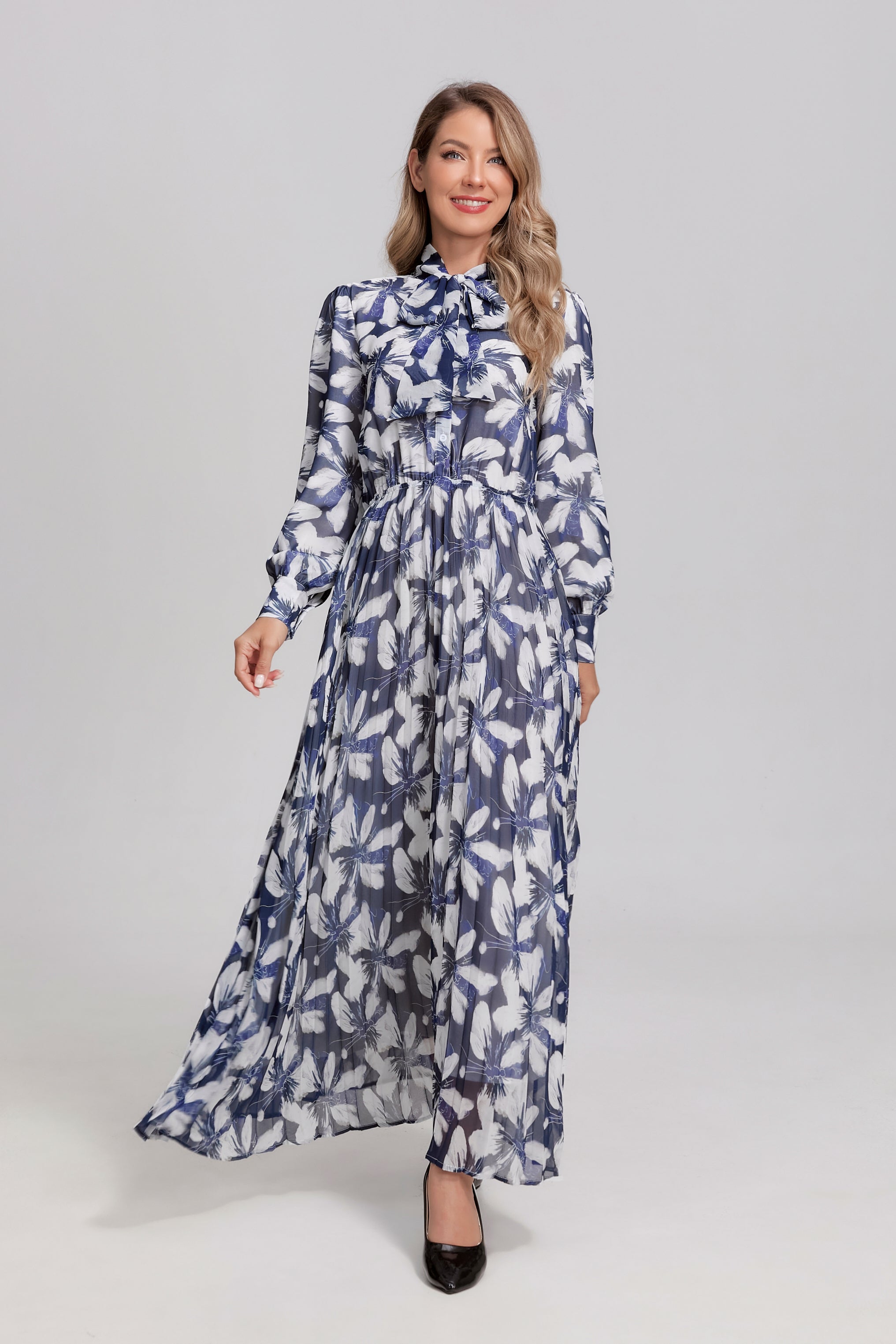 Navy and white feather tie-neck midi dress by MissFinchNYC, featuring a flowy silhouette and elegant design.