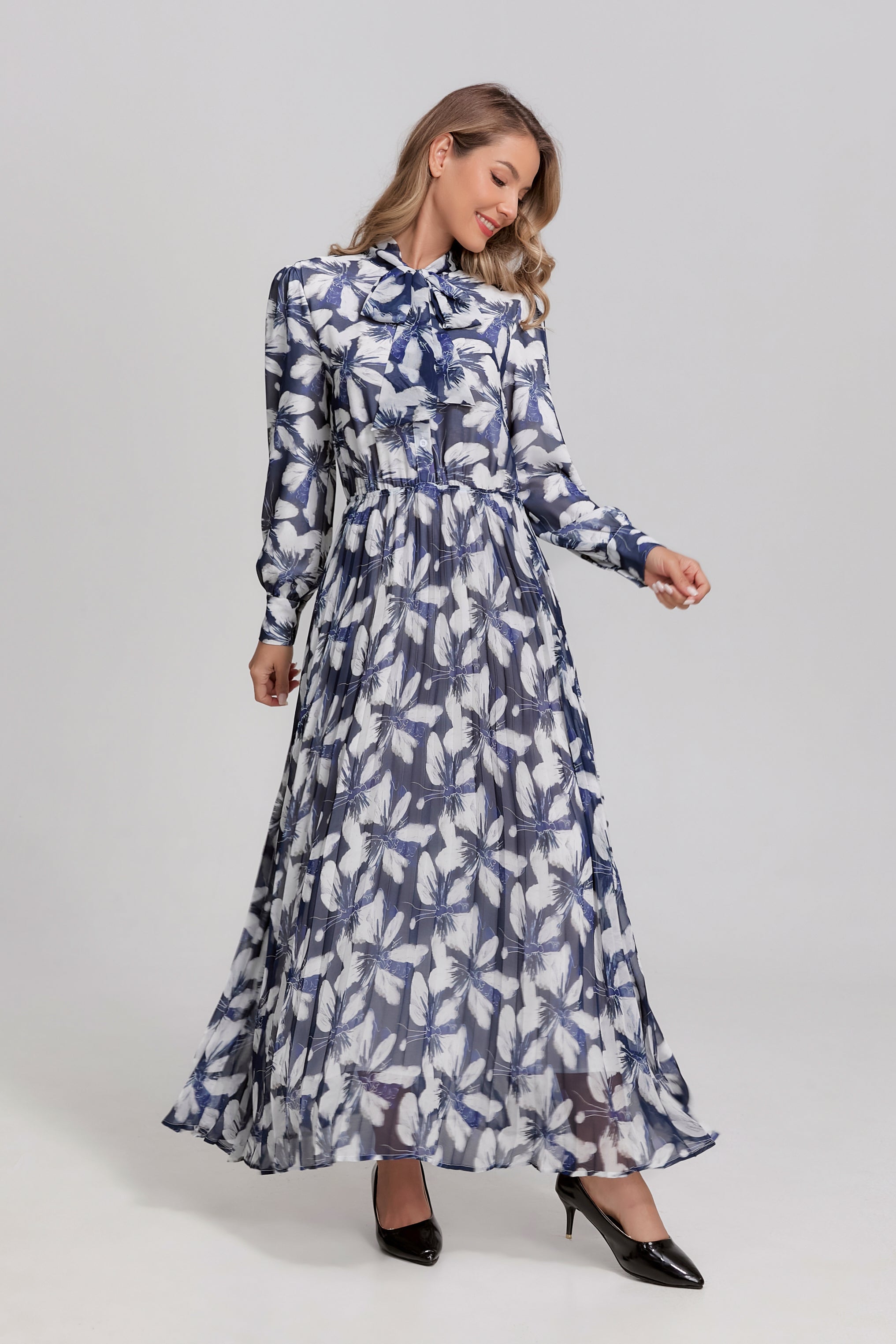Navy and white feather tie-neck midi dress by MissFinchNYC, featuring a stylish silhouette and elegant design.
