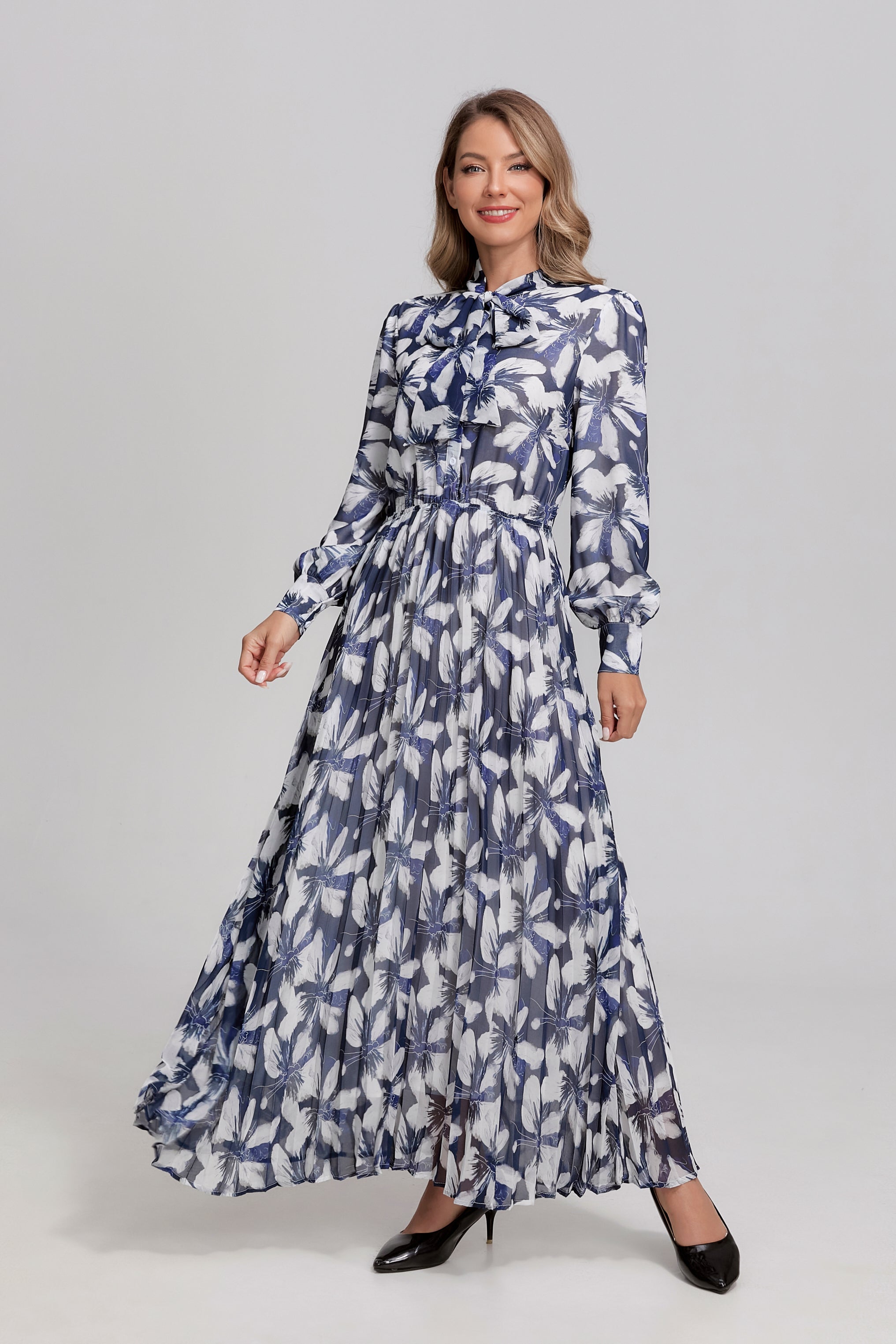 Navy and white feather tie-neck midi dress by MissFinchNYC, featuring a flowing silhouette and elegant design.