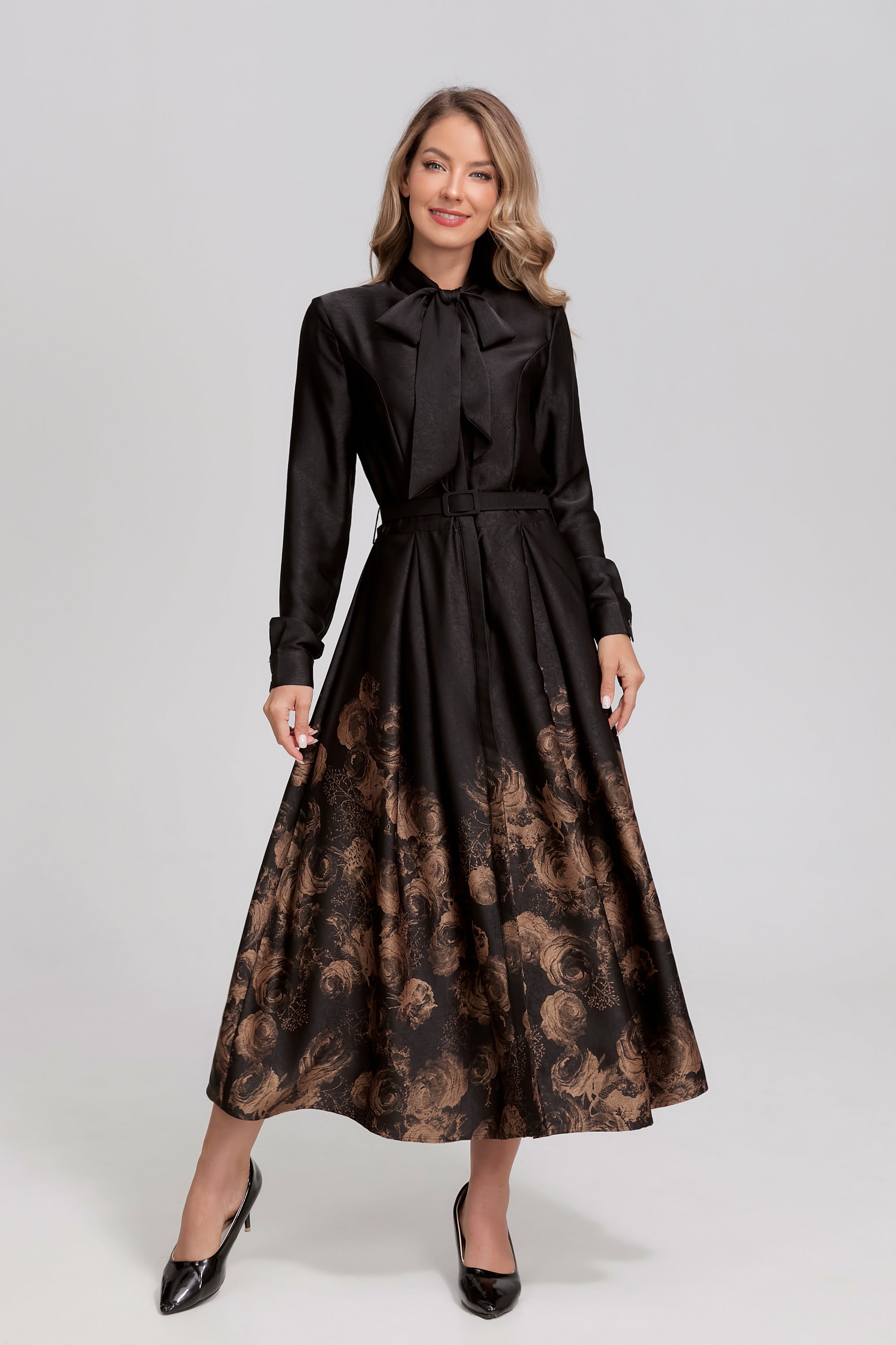 Black Noir Rosewood tie-neck midi dress by MissFinchNYC, featuring a sleek silhouette and elegant design.