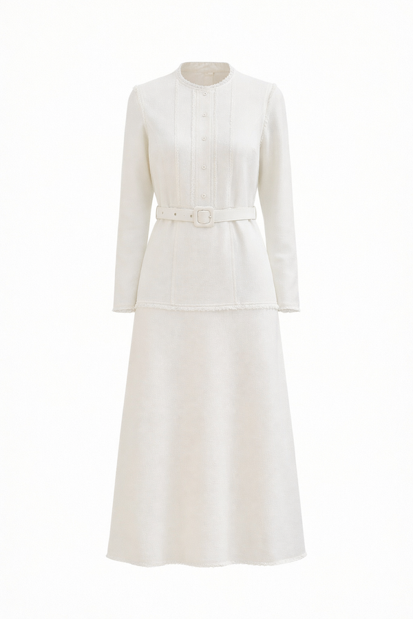 Ivory Grace belted midi dress by MissFinchNYC, showing a flowy dress with a waist belt and elegant midi length on a model.